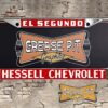 A vintage style reproduction dealership license plate frame for the Hessell Chevrolet dealership of El Segundo. This reproduction dealership license plate frame will look great bolted on to your Classic Chevy whether it’s a Cruiser, a Hot Rod or a Muscle Car.