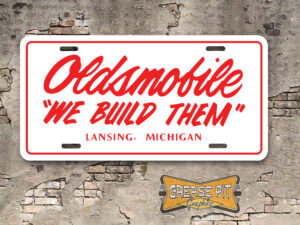 Oldsmobile "We Build Them" License Plate