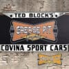 A newly produced vintage style Ted Block's Covina Sport Cars reproduction dealer license plate frame for your Classic Sports Car.