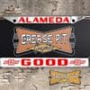 A vintage style reproduction Good Chevrolet license plate frame from the defunct dealership of Alameda, California . This reproduction dealer license plate frame will look great bolted on to your Classic Chevy whether it’s a Cruiser, a Hot Rod or a Muscle Car.